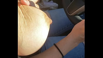 In the car with my tits out! Pumped my nipples keep them out playing with my nipples, and watching peoples reactions!!
