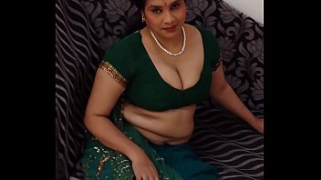 Indian woman clothed on couch