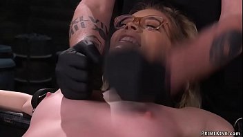 Blonde slave in glasses Katie Kush gets arms strapped to metal and back arched then pussy finger fucked by master The Pope later toyed