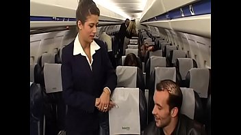 Sexy flight attendant Alyson Ray takes  passenger's hard cock in her perfect ass swallows a lot of his cum after the flight