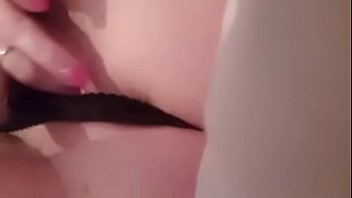 Whore finger fucks her cunt in black panties