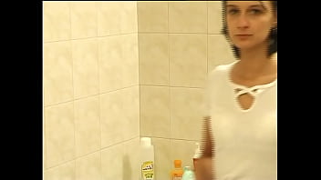 His wife takes a shower and he films her with his video camera