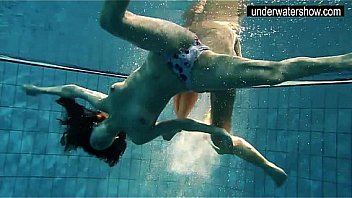 Two sexy amateurs showing their bodies off under water