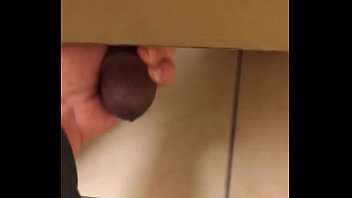 Jerking a big black cock in mall restroom