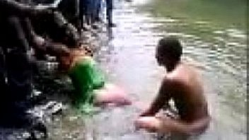 Indian people bathing in a river