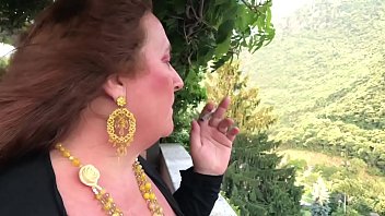 Slut wife Augusta smoking  in public with very long cigarette holders in public